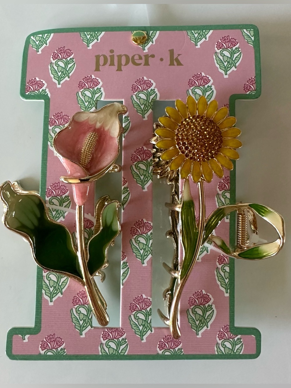 gold toned metal sunflower and peace lily claw hair clips